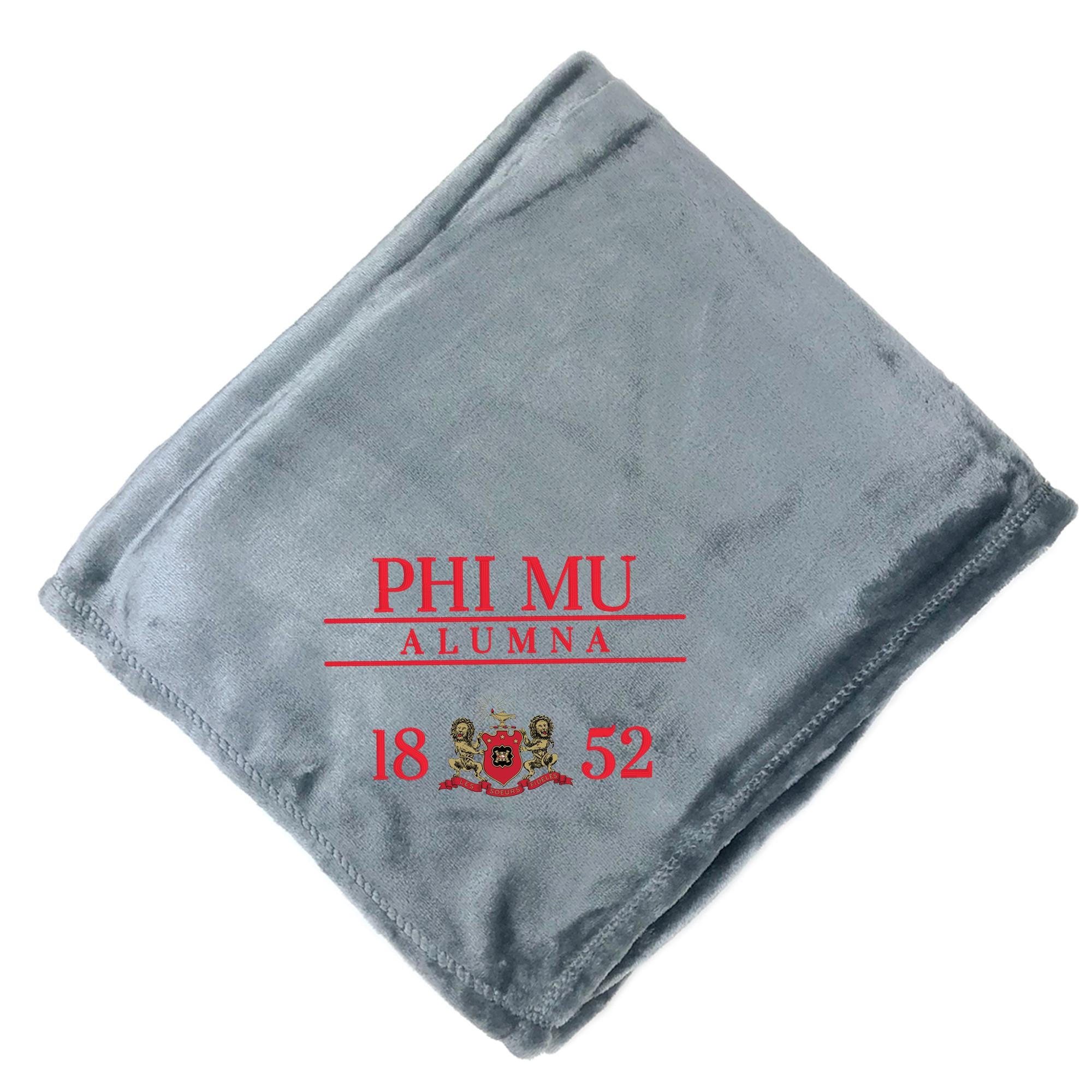 A gray fleece blanket with red text and logos printed on it.