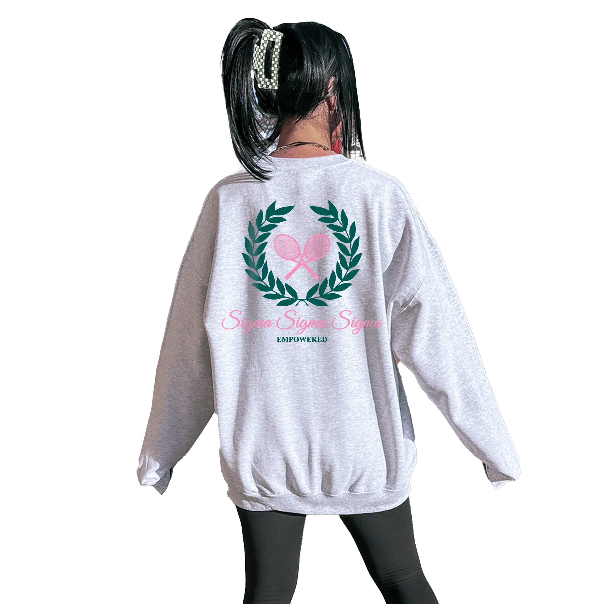 A person wearing a grey sweatshirt with a graphic design on the back.