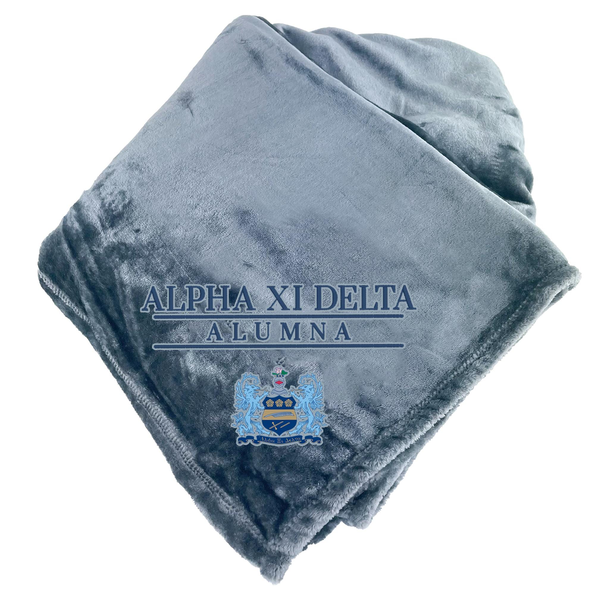 A gray fleece blanket with the text "ALPHA XI DELTA ALUMNA" printed on it, along with a crest design.