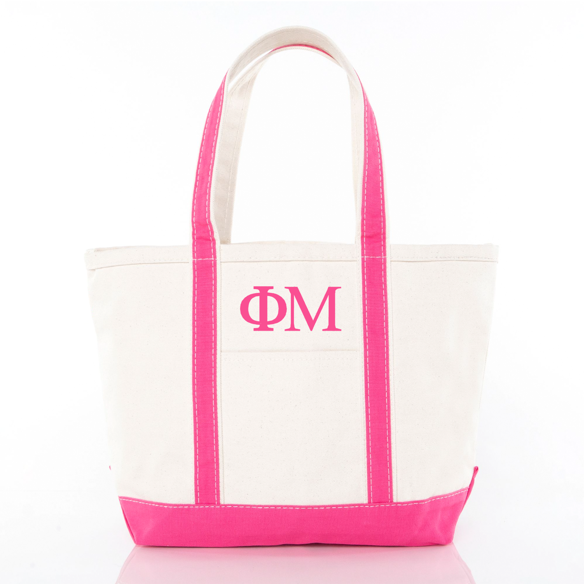 A white tote bag with pink trim and the initials "ΦΜ" printed on it.