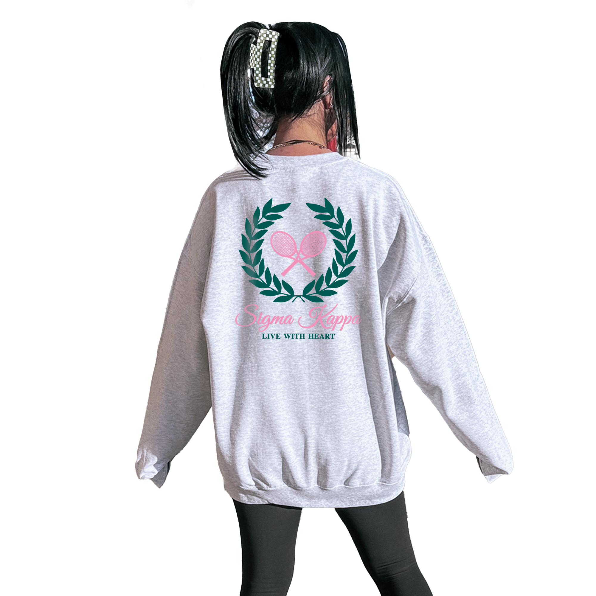 A person wearing a grey sweatshirt with a graphic design on the back.