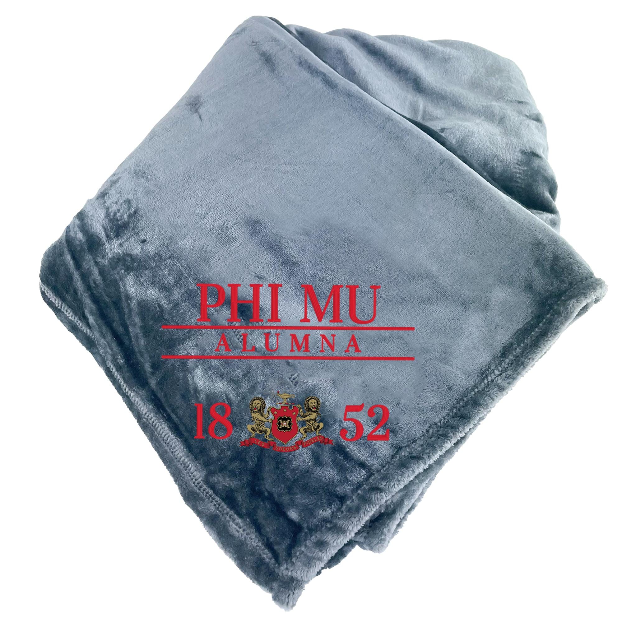 A gray fleece blanket with red text and logos, including the text "PHI MU ALUMNA 18 52" and a crest design.