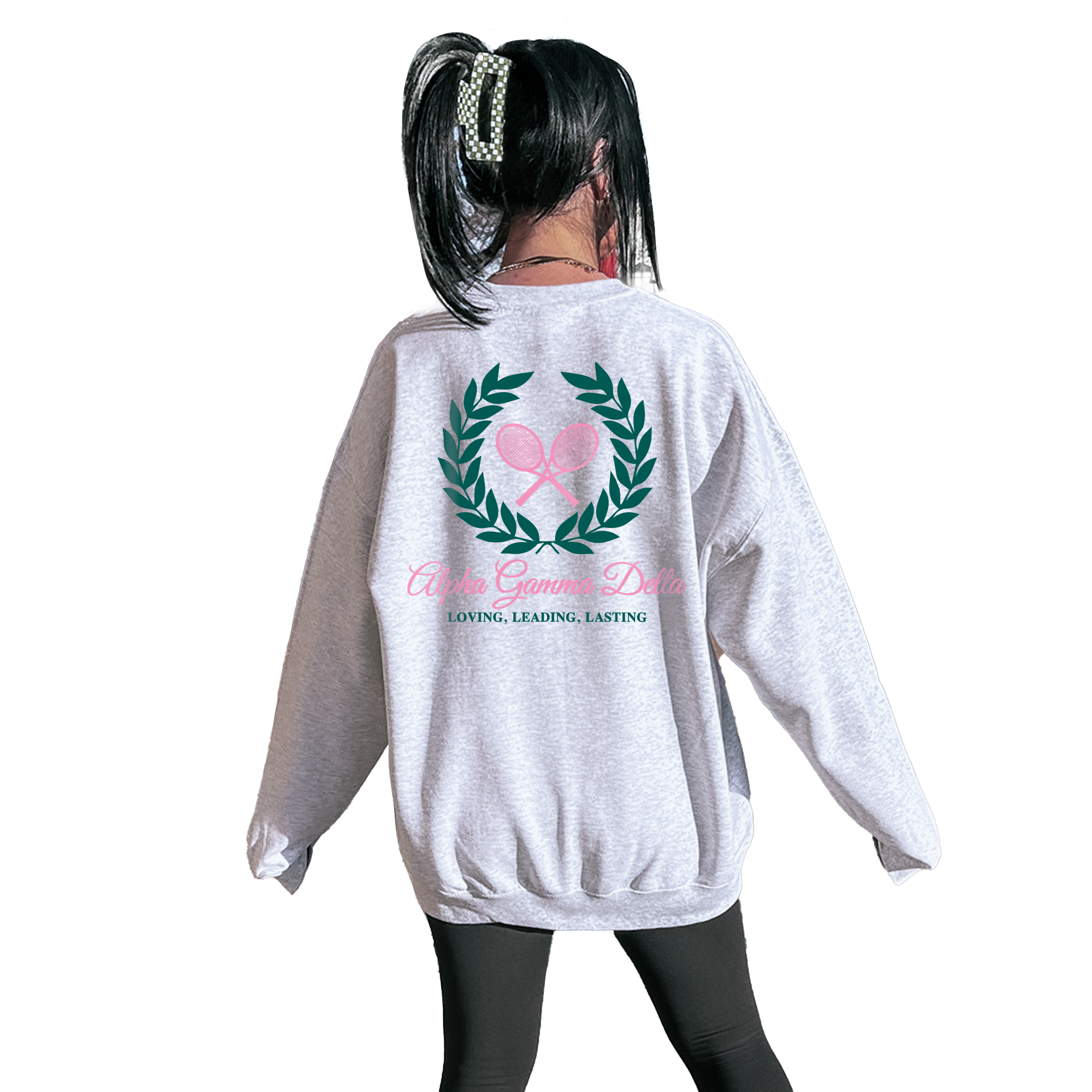 A person wearing a grey sweatshirt with a logo on the back.