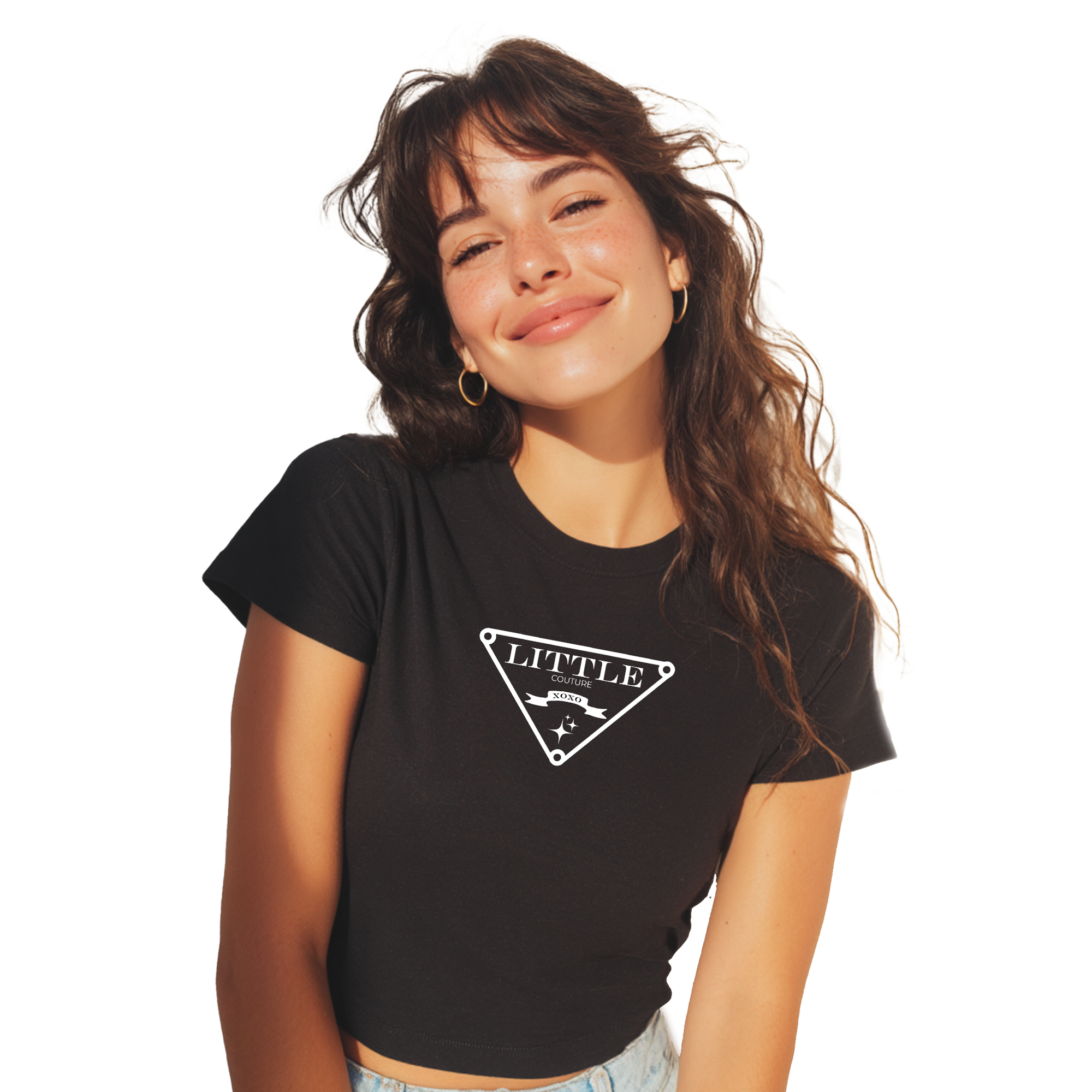 A young woman with long brown hair is smiling and posing for the camera. She is wearing a black t-shirt with a white graphic design on it.