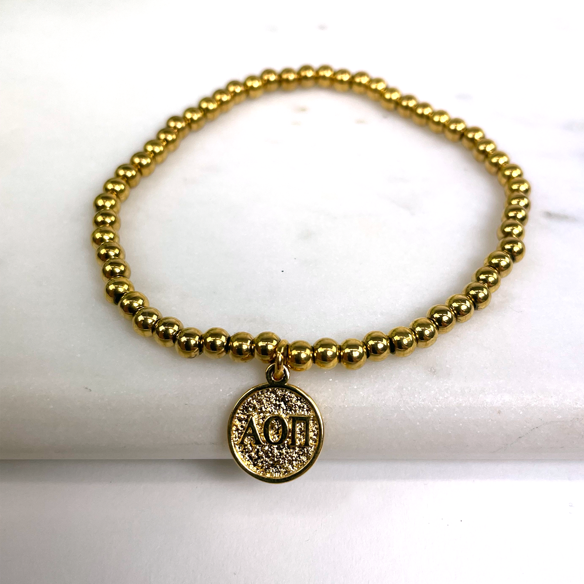Alpha Omicron Pi Gold Beaded Stretch Bracelet
