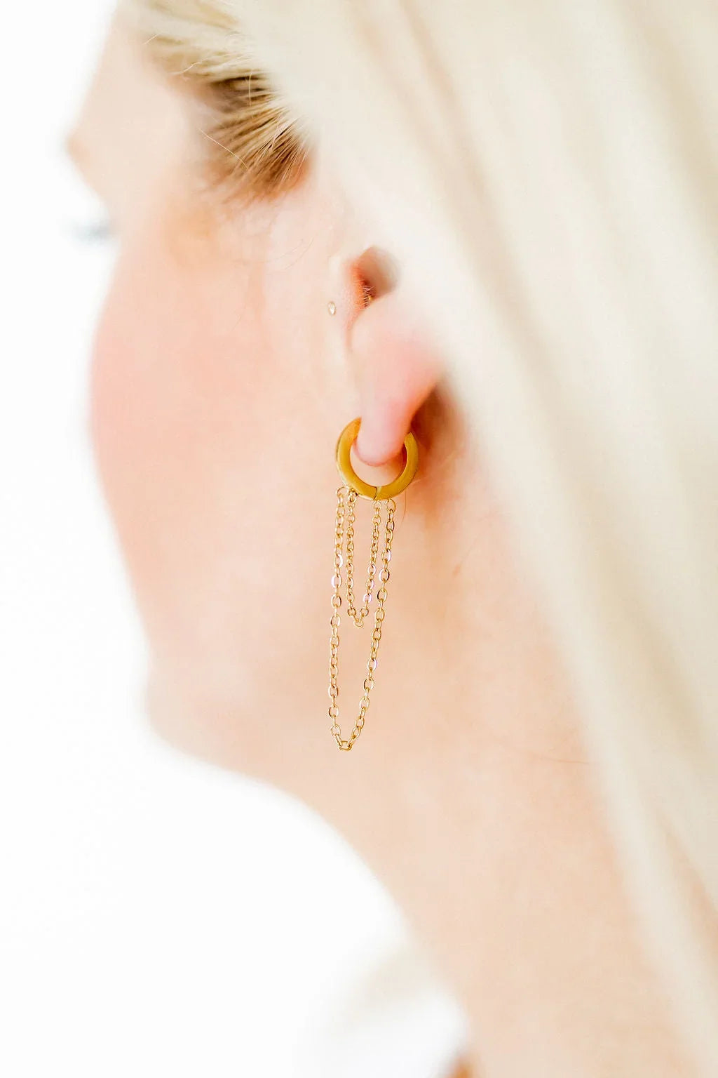 Gwen Gold Huggie earrings worn