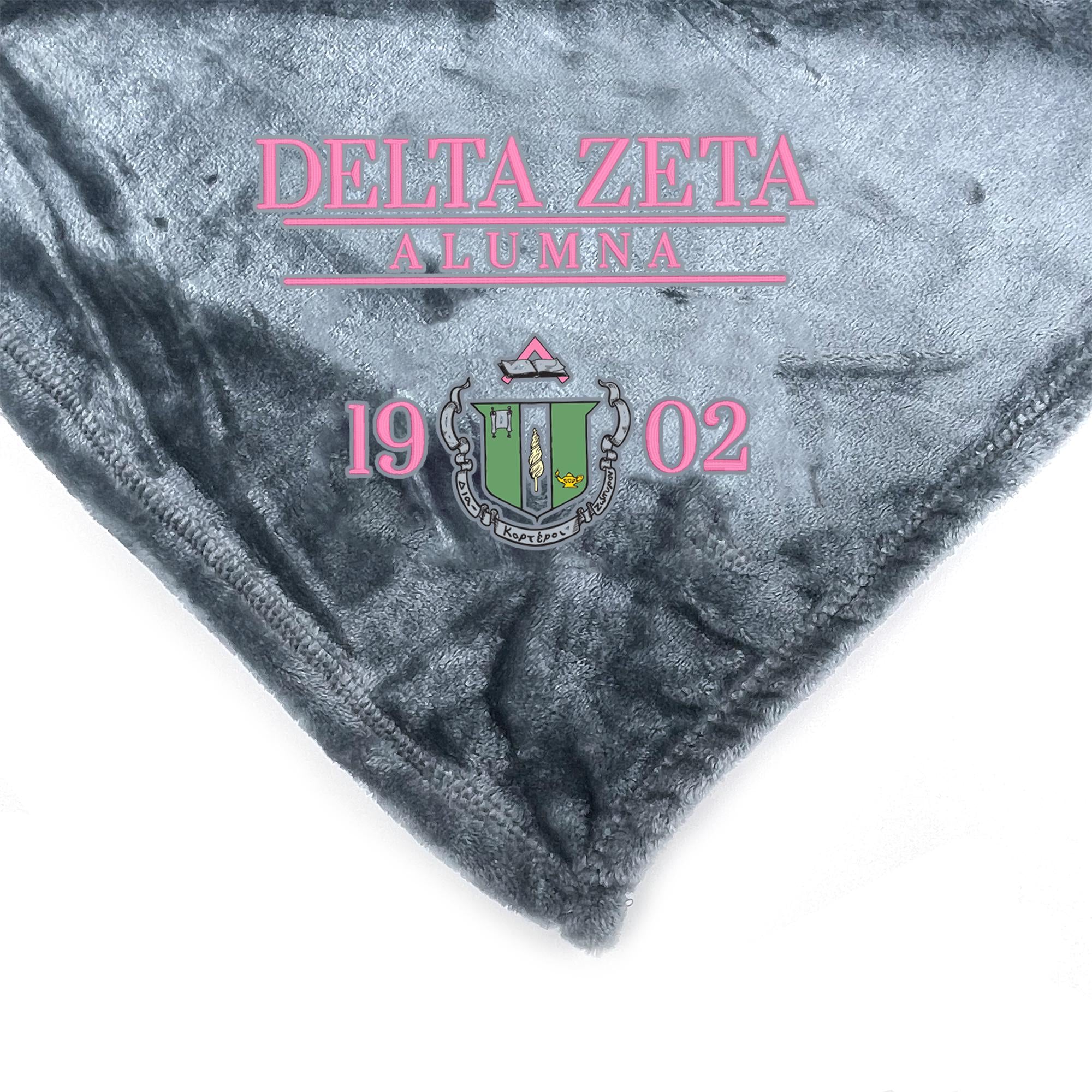 a close-up of a gray fabric with text and a crest on it.