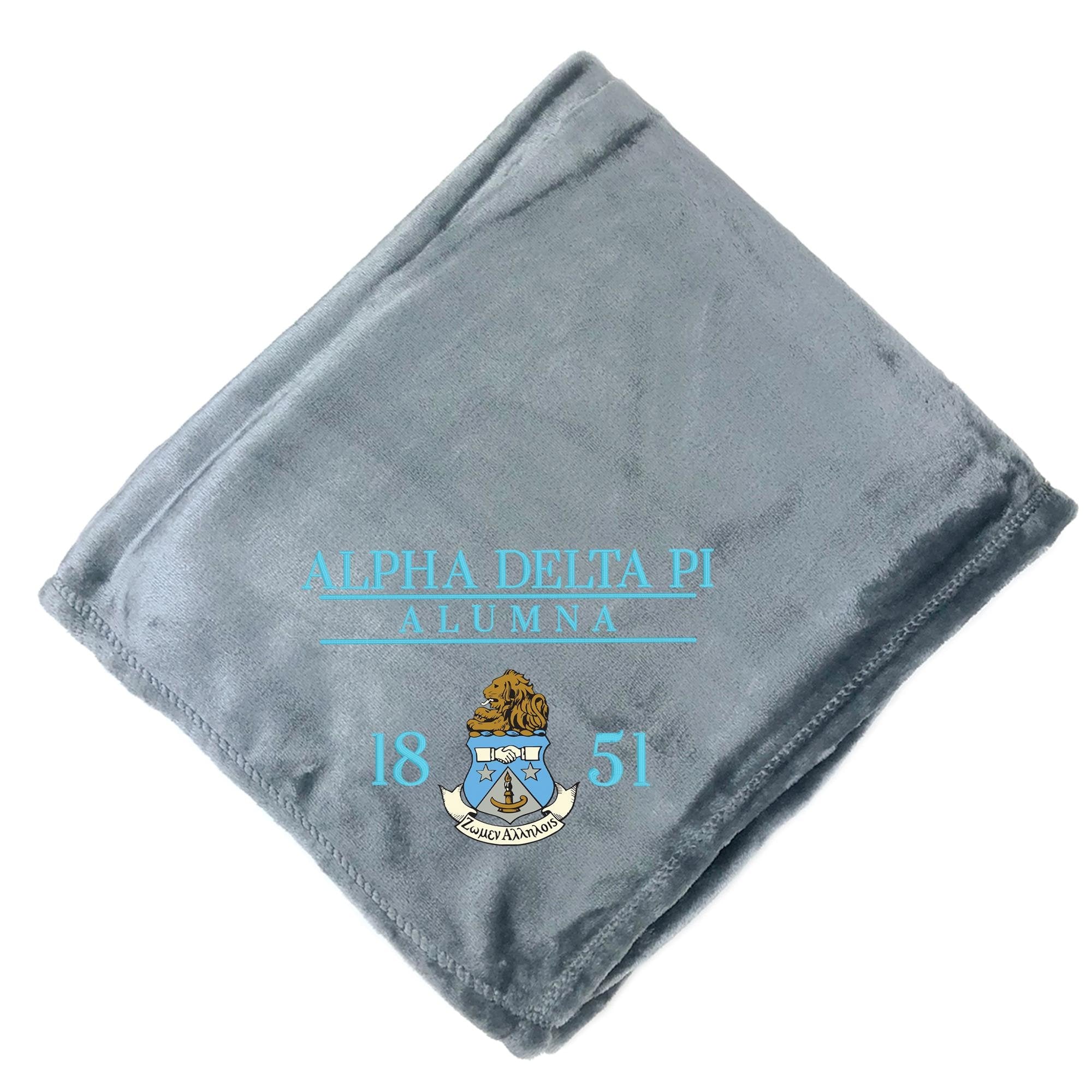 a gray blanket with text and a crest printed on it.
