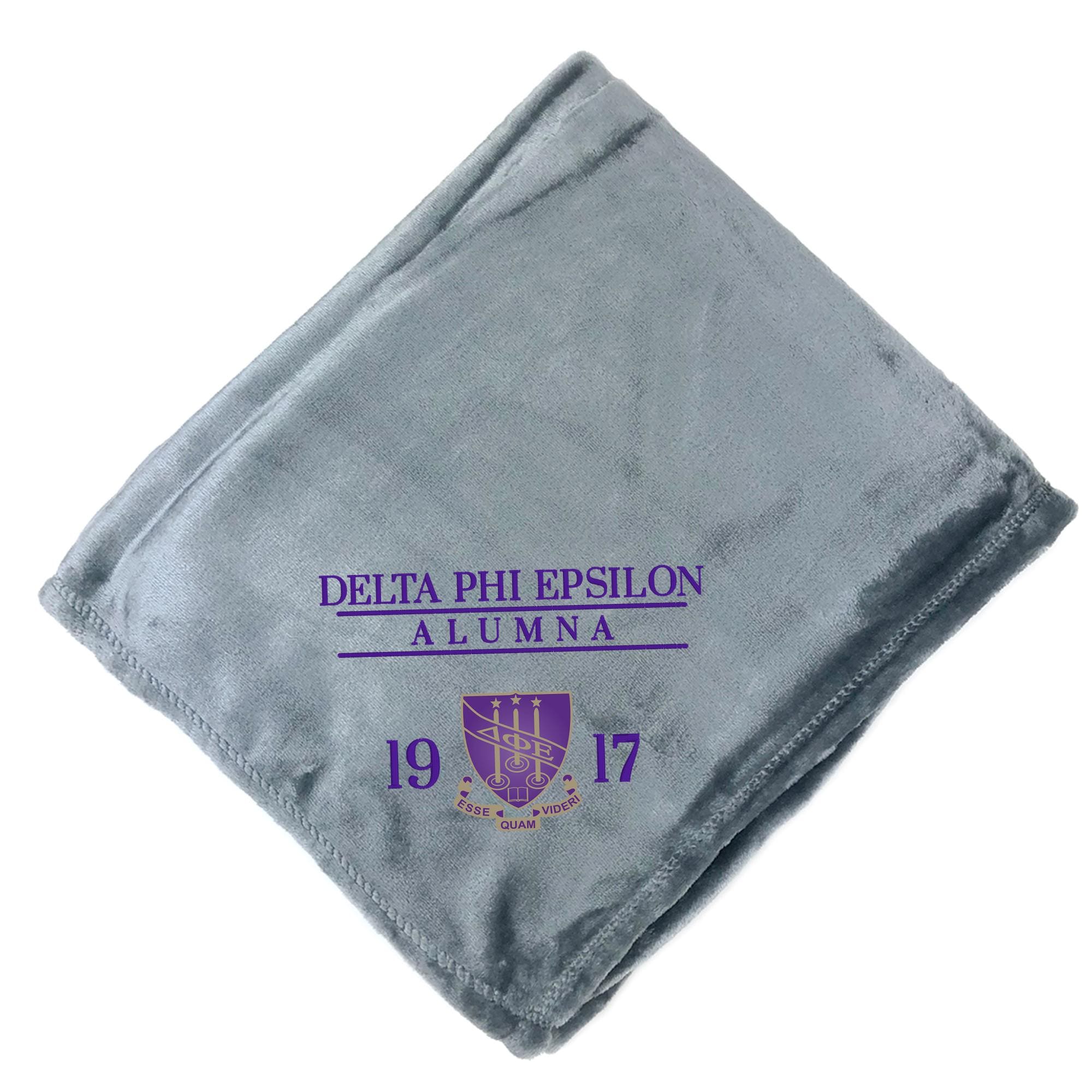 A gray fleece blanket with text and a crest printed on it.