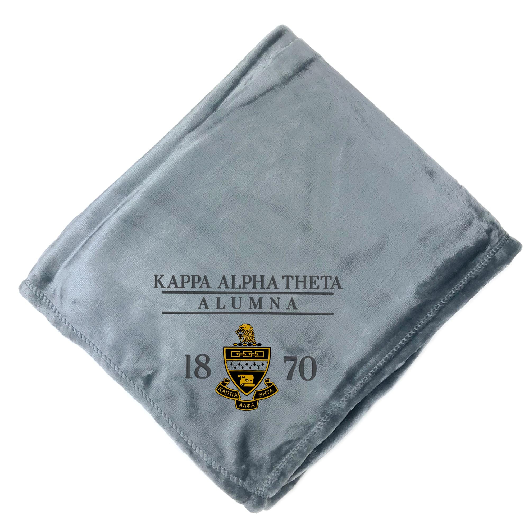 A gray fleece blanket with text and logos printed on it.