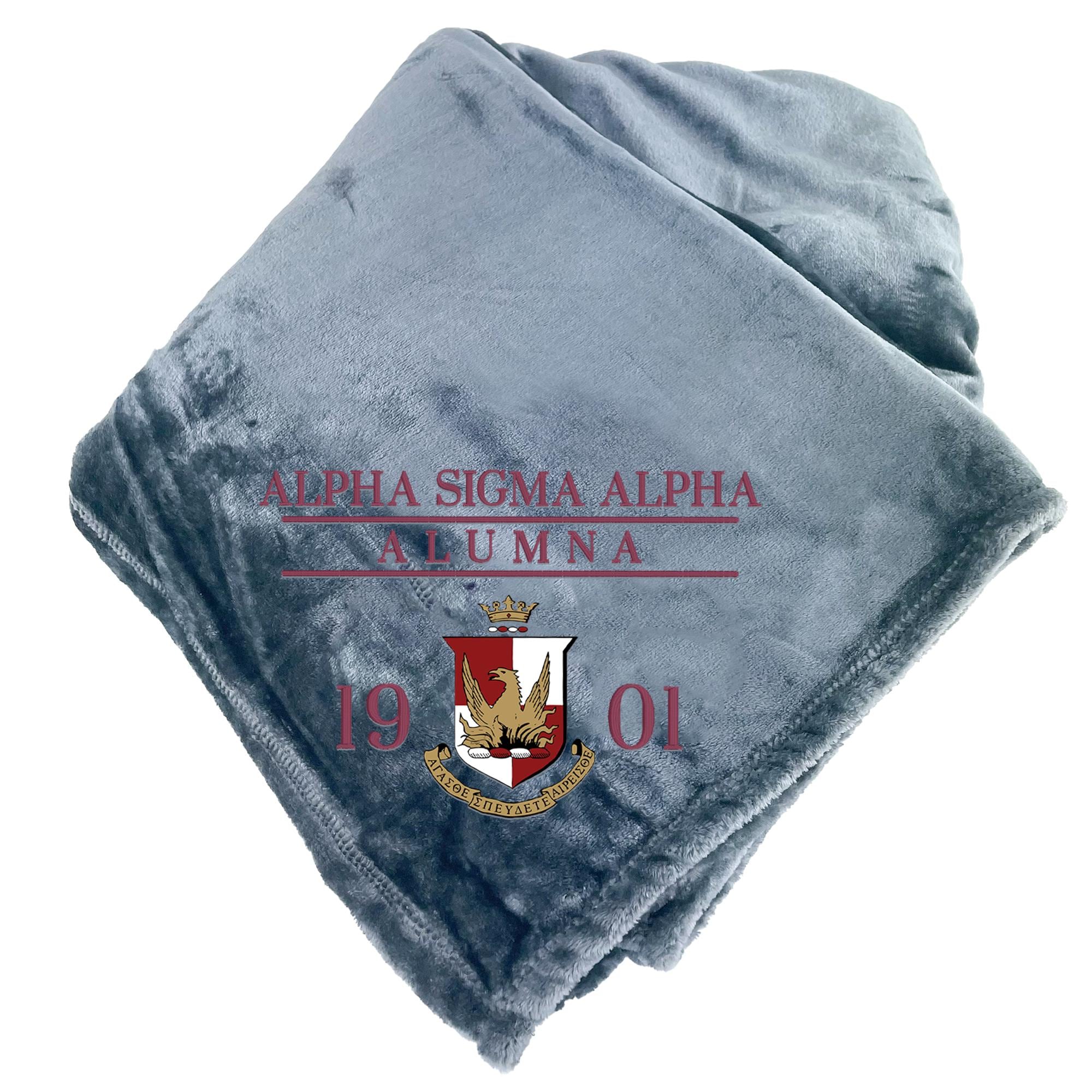 A gray blanket with the text "ALPHA SIGMA ALPHA ALUMNA" and a crest design printed on it.