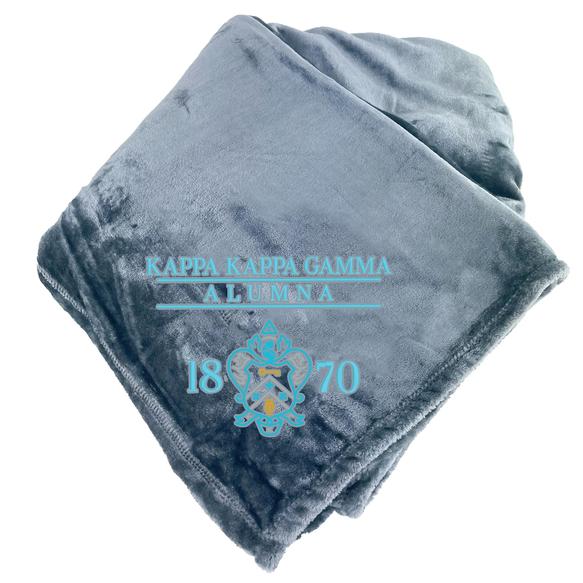 a gray blanket with text and a crest printed on it.